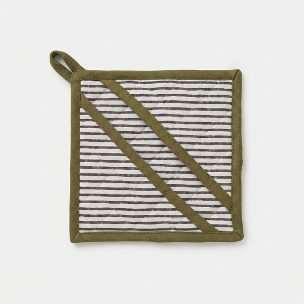 Sylvie Thiriez Aux Petits Oignons oven mitt, green binding, white and black striped quilted fabric, flat lay front view.