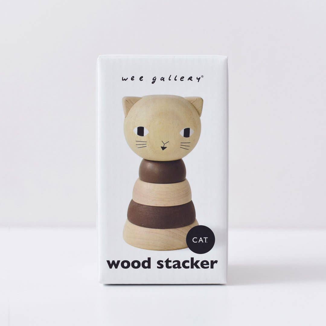 Wooden Cat ring stacker in natural and dark brown tones, shown on its white product box, front view