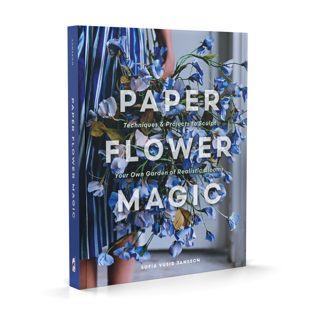 Paper Flower Magic book, angled view showing cover art of a person holding blue paper sweet pea flowers.
