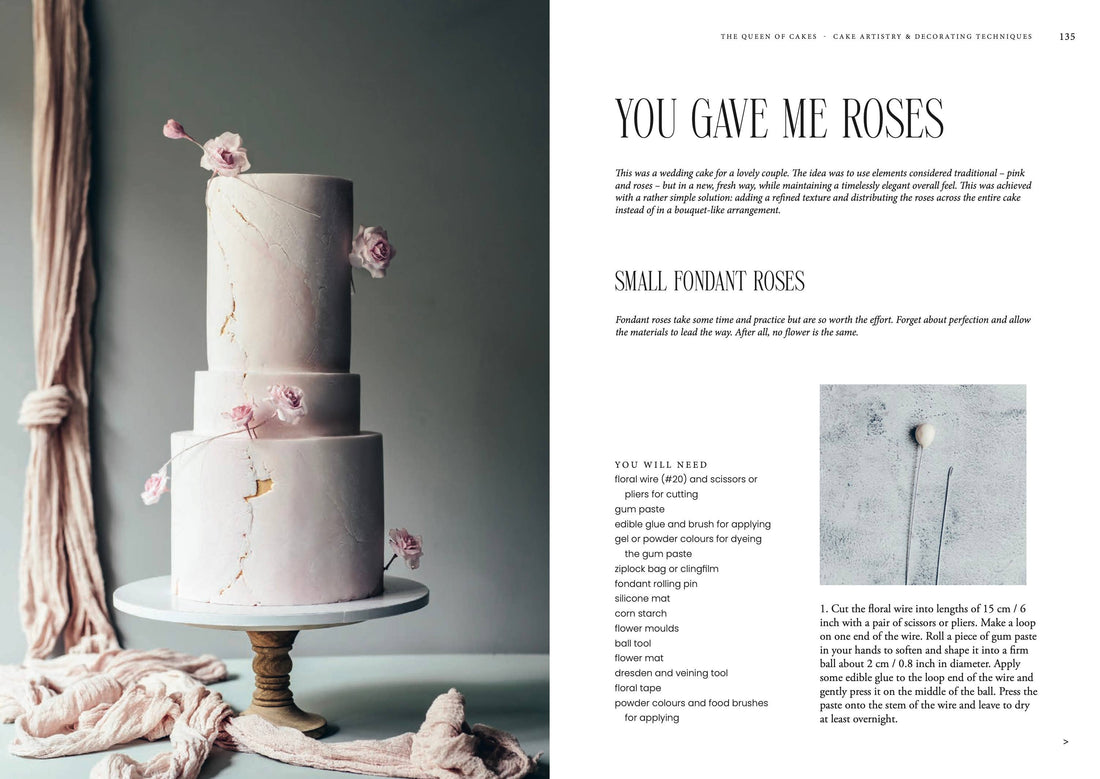 Queen of the Cakes Gluten-free Baking book open to recipe for small fondant roses, showing pink tiered cake with gold cracks…