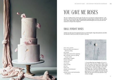 
                    
                      Queen of the Cakes Gluten-free Baking book open to recipe for small fondant roses, showing pink tiered cake with gold cracks…
                    
                  