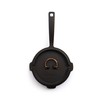 
                    
                      Barebones 12" Cast Iron Skillet with Dutch Oven Lid, black cast iron with copper handle, top view on white.
                    
                  