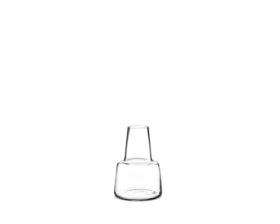 
                    
                      Flora clear mouth-blown glass vase, featuring a tapered neck and rounded base, front on white.
                    
                  