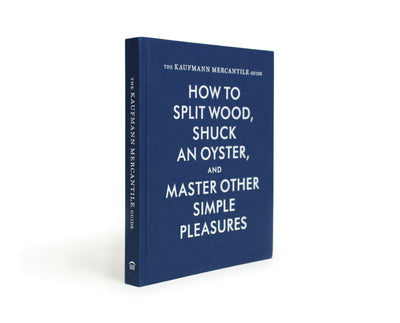 
                    
                      The Kaufmann Mercantile Guide print book, navy blue hardcover with white text, angled view showing the full front and spine.
                    
                  