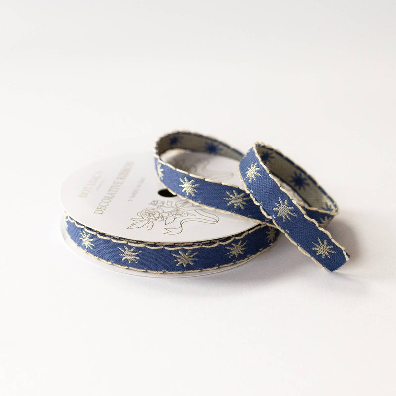 Botanica Paper Co. Stars Embroidered Ribbon, deep blue with gold stars and scalloped trim, full spool with unspooled length.