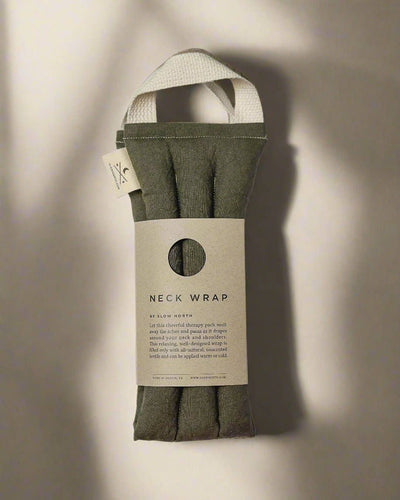 
                    
                      Olive Microwaveable Neck Wrap, cotton and linen blend, folded and packaged with descriptive label, showing cream handle…
                    
                  