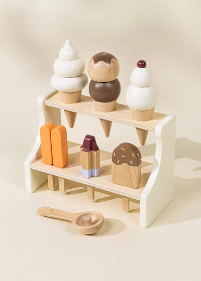 
                    
                      Wooden Ice Cream Stand play food set, natural wood, white, brown, orange, and maroon pieces displayed on stand.
                    
                  