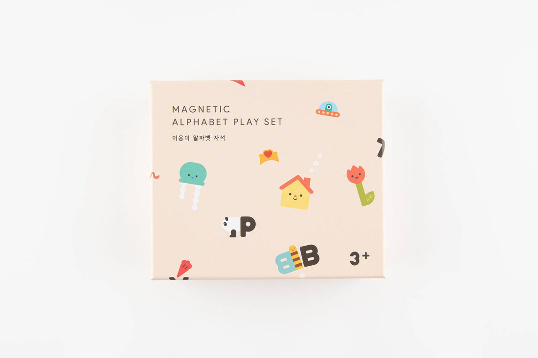Magnetic Alphabet Play Set, beige recycled cardboard box with colorful cartoon illustrations, angled top-front view.