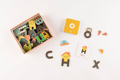 
                    
                      Magnetic Alphabet Play Set components: colorful letters, animal & object shape magnets, and recycled cardboard word cards,…
                    
                  
