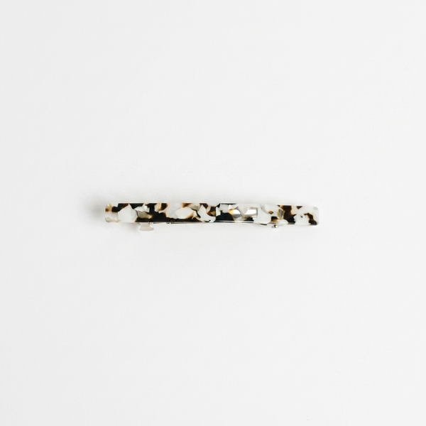 NAT + NOOR Coco Cream hair clip, white and brown tortoise cellulose acetate, flat lay front view.