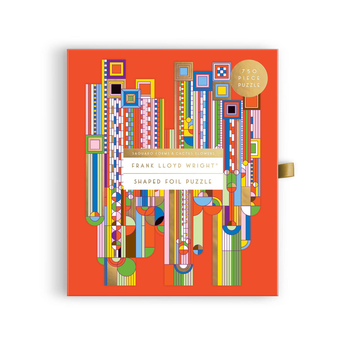 Saguaro Cactus & Forms jigsaw puzzle box, multi-colored geometric design with gold foil on orange, angled top view shows…