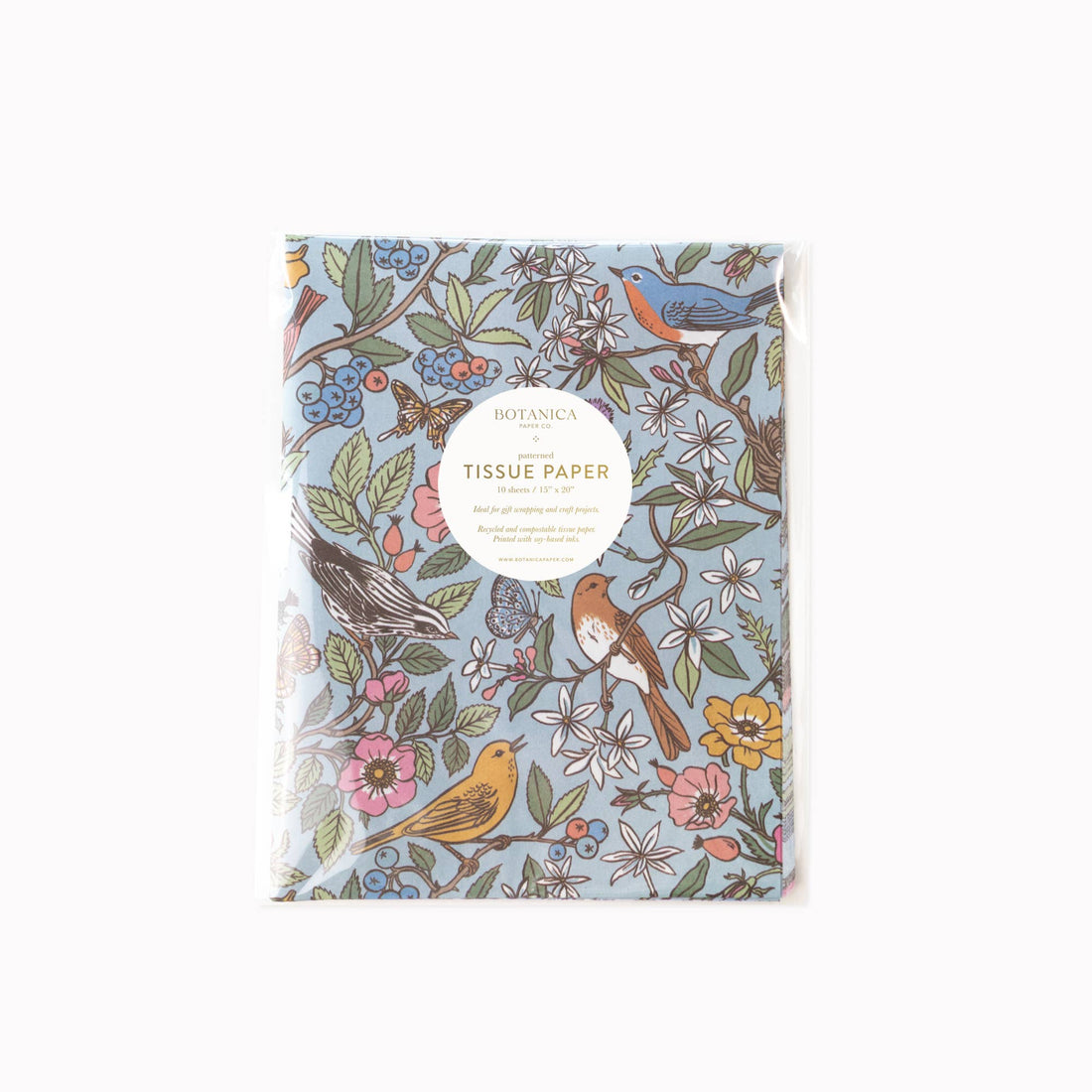 Songbirds Tissue Paper, light blue, multi-color birds, flowers, and butterflies pattern on packaged recycled paper, front…