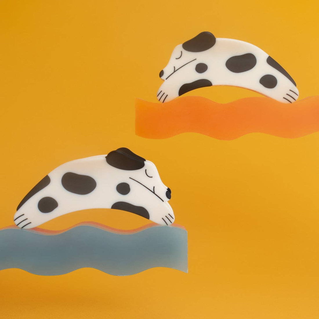 Puppy Claw Spotted Dog Hair Clip pair, white and black spotted matte cellulose acetate, two sleeping dogs on wavy orange and…