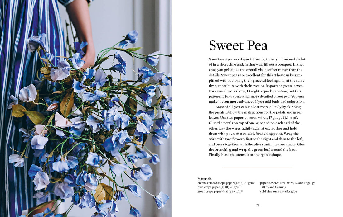 Paper Flower Magic book interior: Sweet Pea paper flowers bouquet, blue and purple crepe, held in hand close-up.