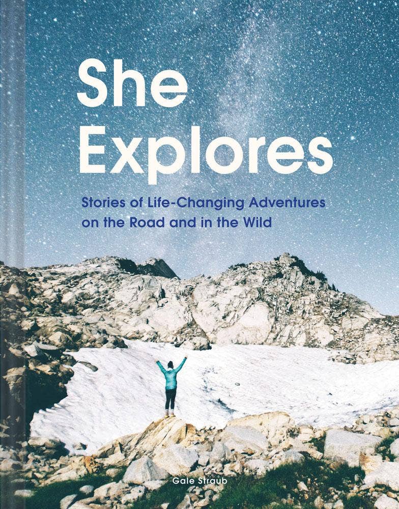 She Explores book cover, starry night sky and person celebrating on a snowy mountain peak, front view.