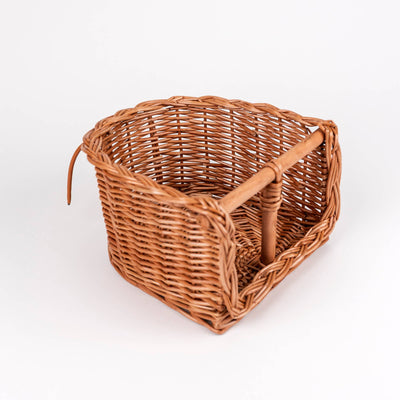 
                    
                      Wicker Bike Seat for Dolls, natural woven brown wicker, top-down angled shot revealing the interior wooden support.
                    
                  