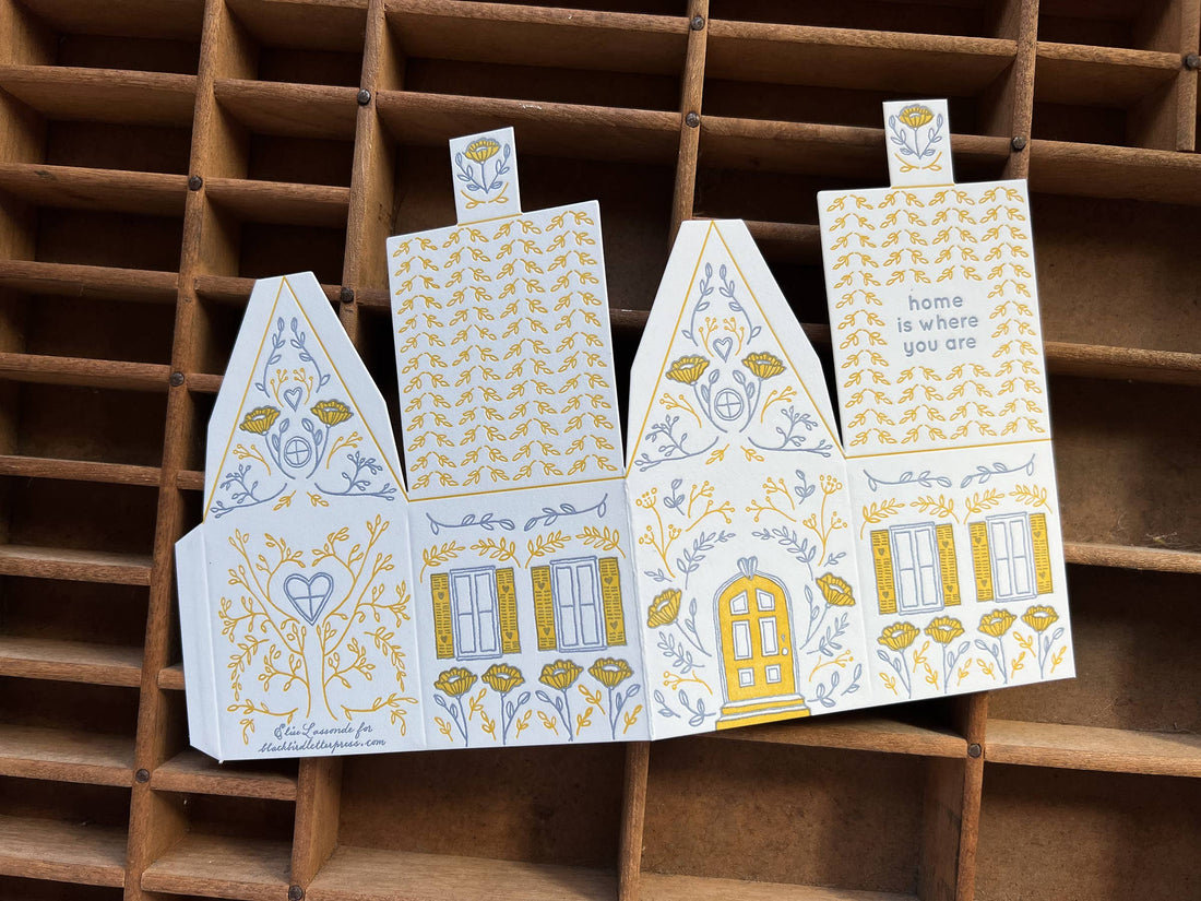 Home Is Where You Are 3D die-cut greeting card template, white cotton paper with yellow and blue letterpress illustrations,…