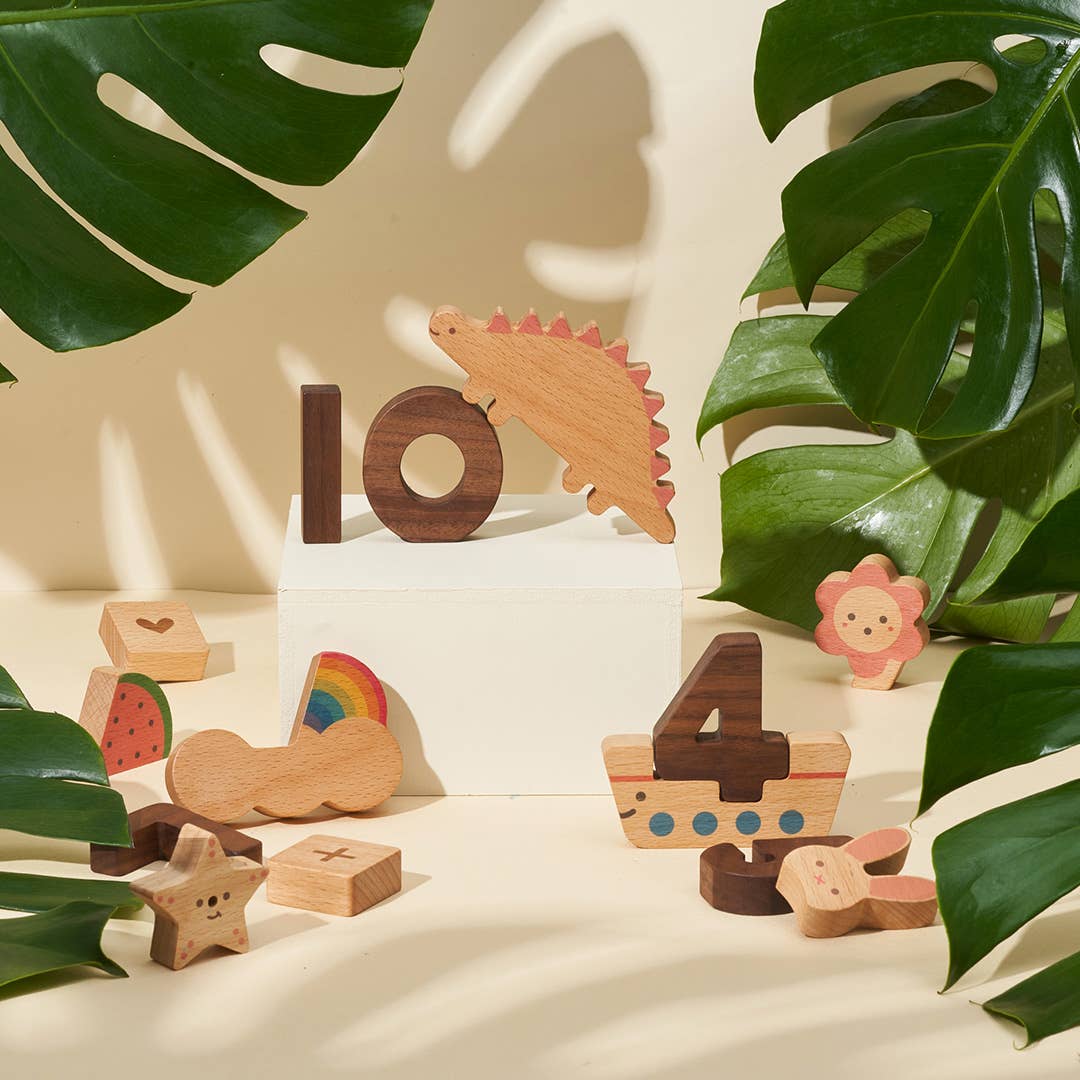 Numbers Play Block Set, natural beech and walnut wood. Number 10, a red-spiked dinosaur, rainbow, and various learning…