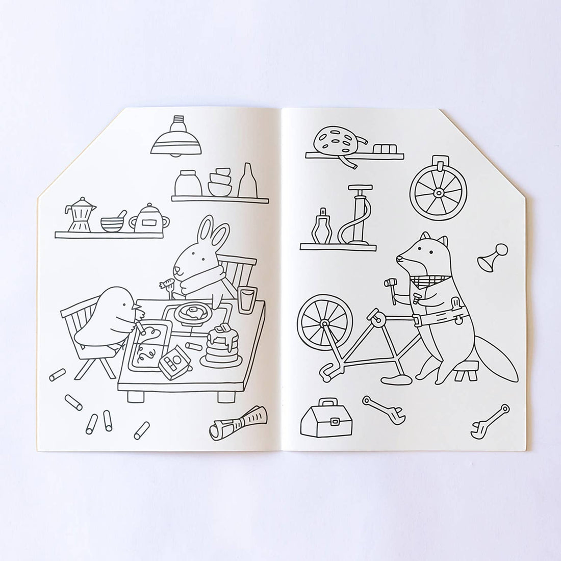 Jumbo House coloring book, open spread with black line drawings: rabbit & bird eating at a table, fox fixing a bike on white…