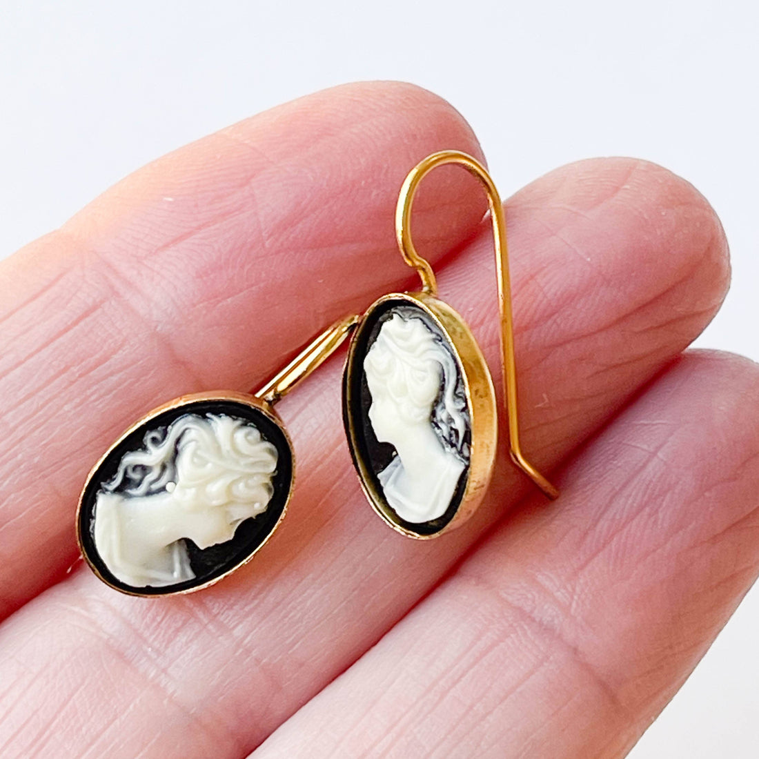 Nest Pretty Things Small Black Cameo earrings, black and white resin cameo with 24K antiqued gold-plated setting, held in…