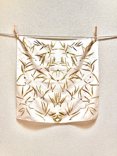 
                    
                      Eucalyptus Grove Silk Bandana Scarf, natural eco-printed eucalyptus leaf pattern on light silk, hanging on clothesline with…
                    
                  