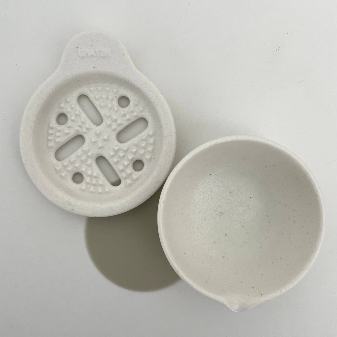 Japanese Vegetable Grater Set, white speckled porcelain. Grater plate with grating nubs, separated from matching catch bowl,…