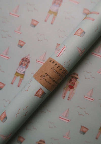 
                    
                      Summer Wrapping Paper, light blue with Agnese Grīnberga summer illustrations. Close-up showing rolled paper and "WRAPPING 3…
                    
                  