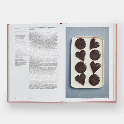 
                    
                      Crumbs: Cookies And Sweets cookbook, open to Chocolate-Glazed Polish Gingerbread recipe, featuring dark heart & round glazed…
                    
                  