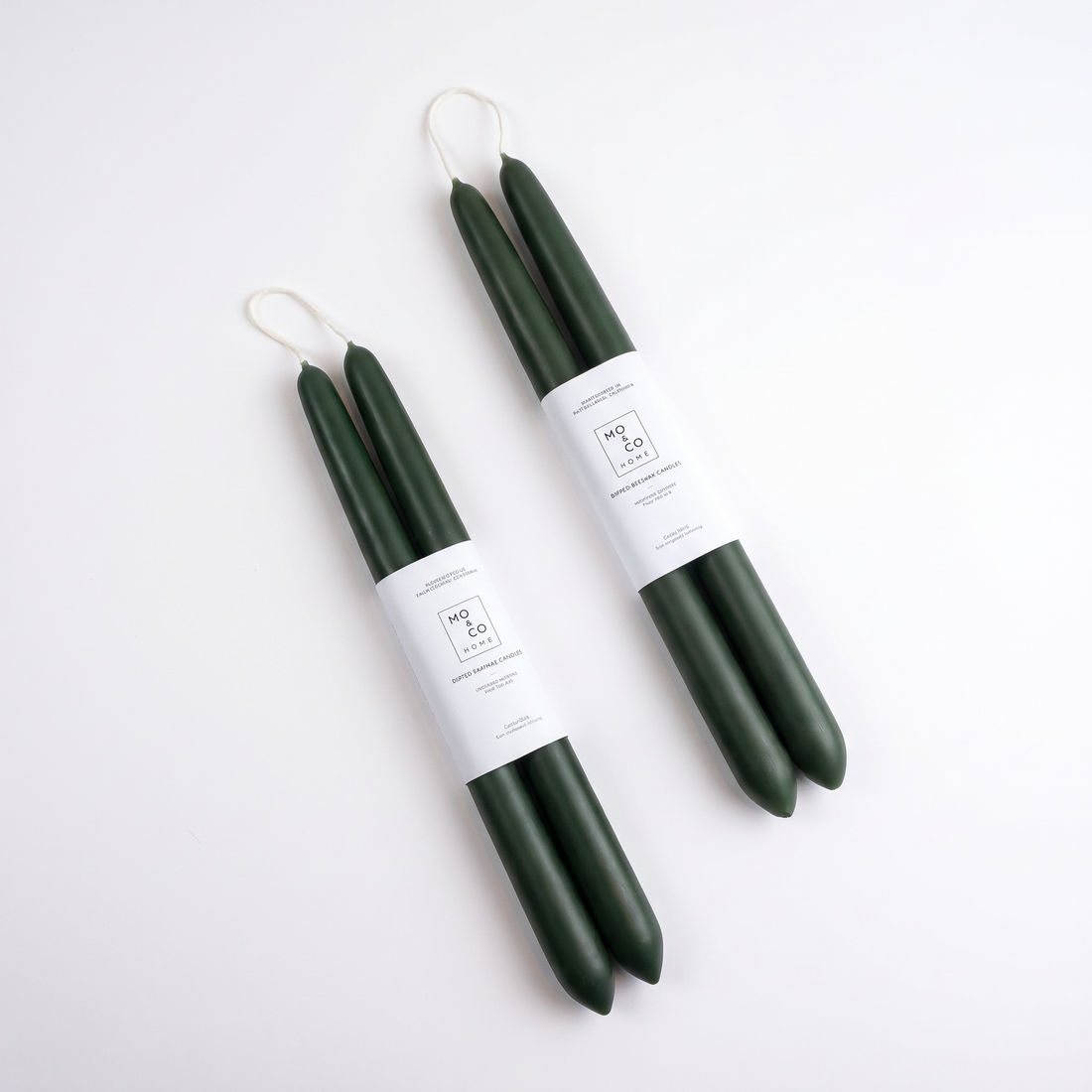 Mo&Co Home Forest Green Dipped Beeswax Taper Candles studio product photo on a neutral off-white background