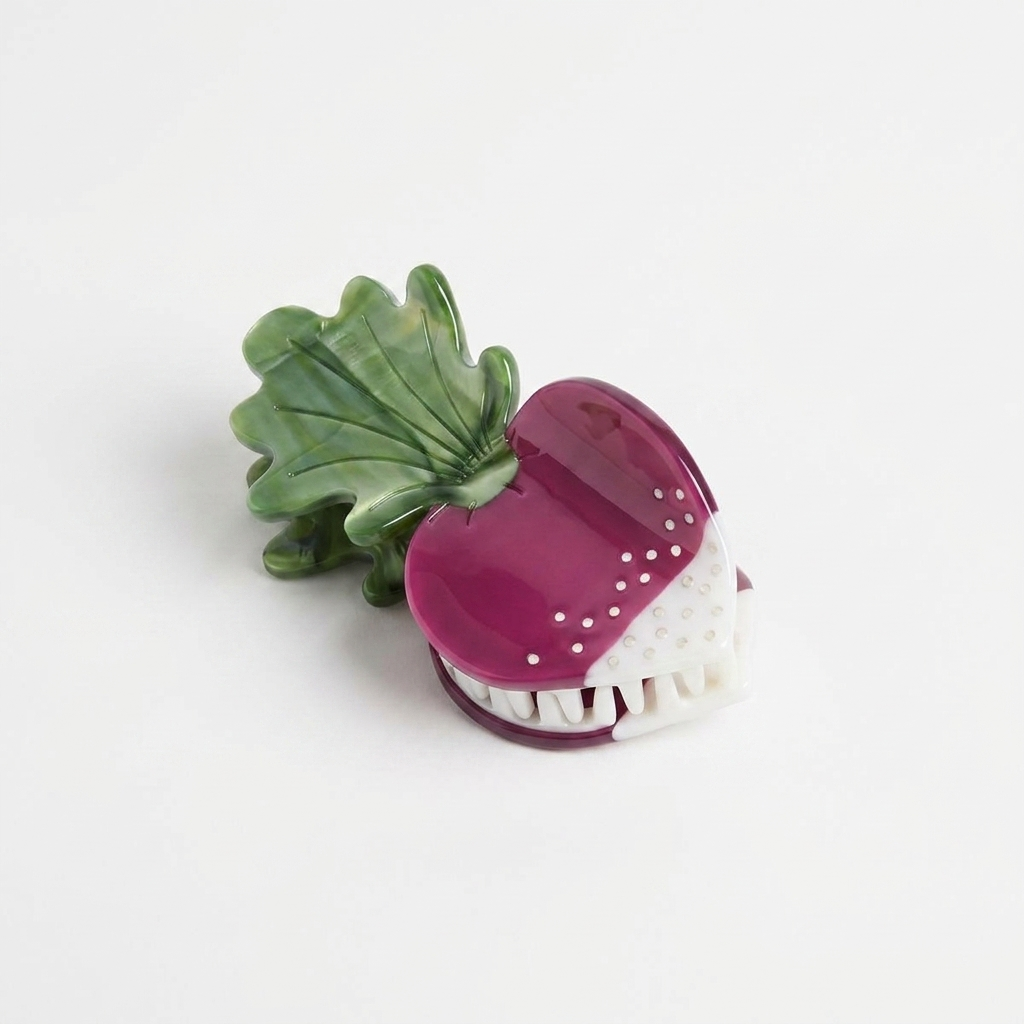 Winona Irene French Radish hair claw, purple cellulose acetate with white rhinestone dots, green leaves, front view on white.