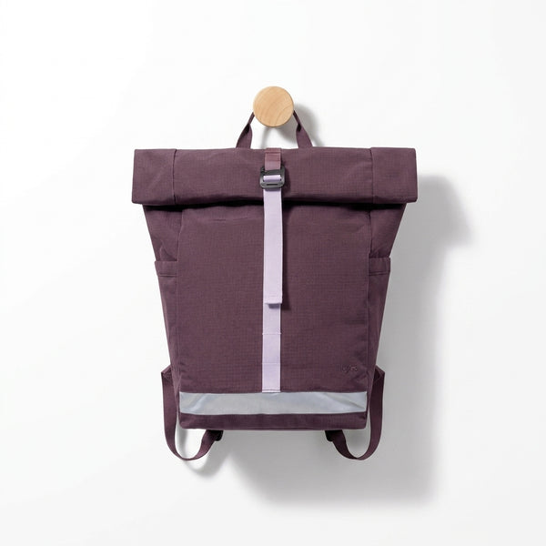 Lefrik Lars Roll backpack, wine RIPSTOP RPET fabric, featuring lilac strap, reflective strip, front view hanging on wooden…