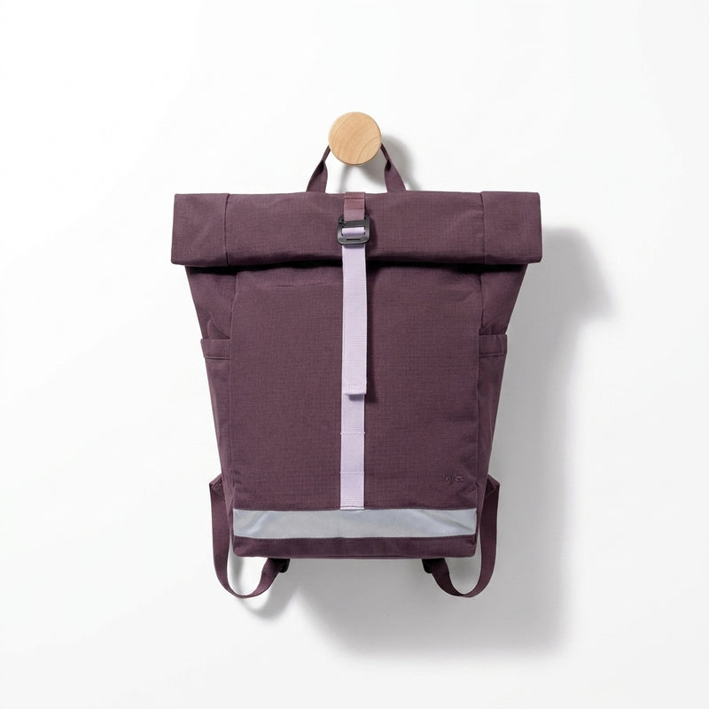 Lefrik Lars Roll backpack, wine RIPSTOP RPET fabric, featuring lilac strap, reflective strip, front view hanging on wooden…