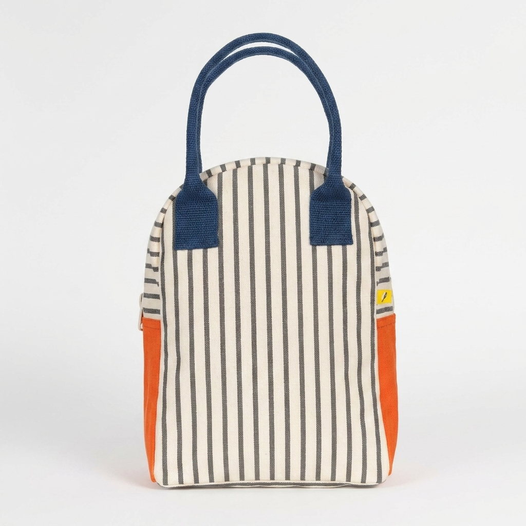 Fluf Lunch Bag - Pencil Stripe Nautical studio product photo hanging from a wooden wall hook on a neutral off-white…