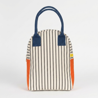 
                    
                      Fluf Lunch Bag - Pencil Stripe Nautical studio product photo hanging from a wooden wall hook on a neutral off-white…
                    
                  