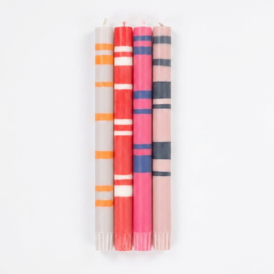 
                    
                      British Colour Standard Reds And Pinks striped dinner candles. Four upright colorful striped candles on white.
                    
                  
