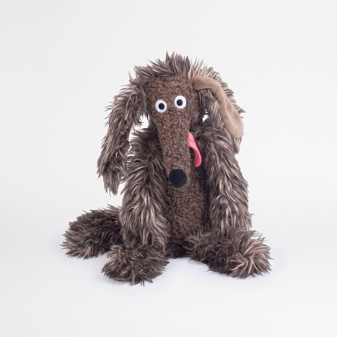 Moulin Roty Dumpster the Dog Stuffed Animal studio product photo on a neutral off-white background