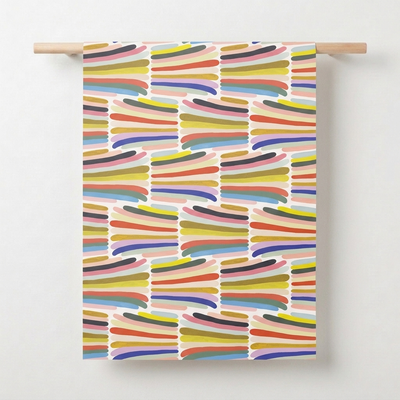 
                    
                      Red Cap Cards Rainbow Stripes wrapping paper, bold rainbow brushstroke pattern, full sheet hung on wood dowel against white.
                    
                  