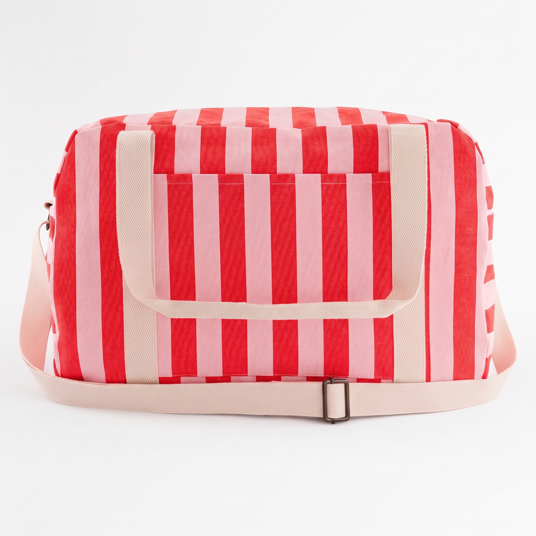 Rose in April Raphael Weekend / Diaper Bag - (Tomato + Candy Pink) studio product photo hanging from a wooden wall hook on a…