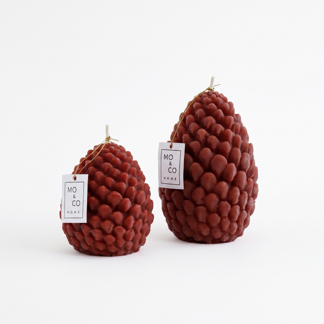 Mo&Co Home Sculpted Beeswax Pine Cones studio product photo on a neutral off-white background