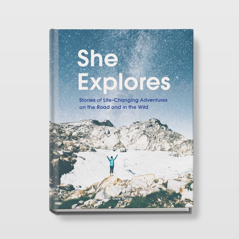 Chronicle Books She Explores book, blue starry cover with a person on snowy mountains, front view on white.