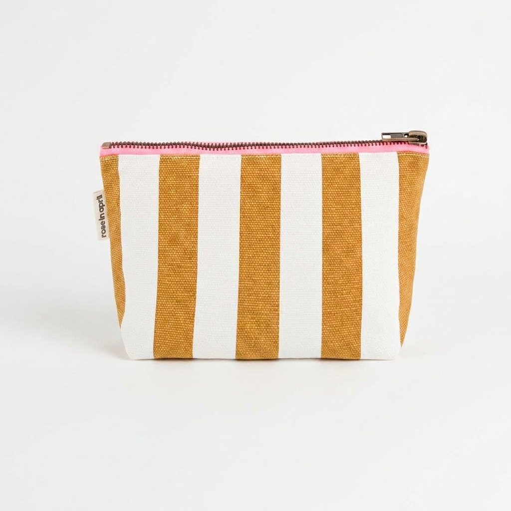Rose in April Sofia Pouch - Caramel studio product photo hanging from a wooden wall hook on a neutral off-white background