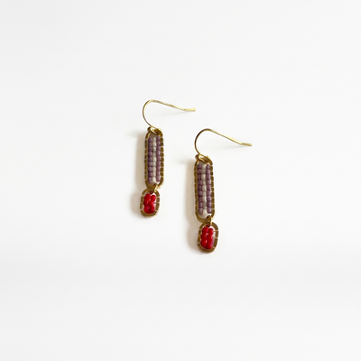 
                    
                      Stripe Beaded Earrings, mauve, white, and poppy red seed beads with gold-plated frames and ear wires, angled flat lay pair.
                    
                  