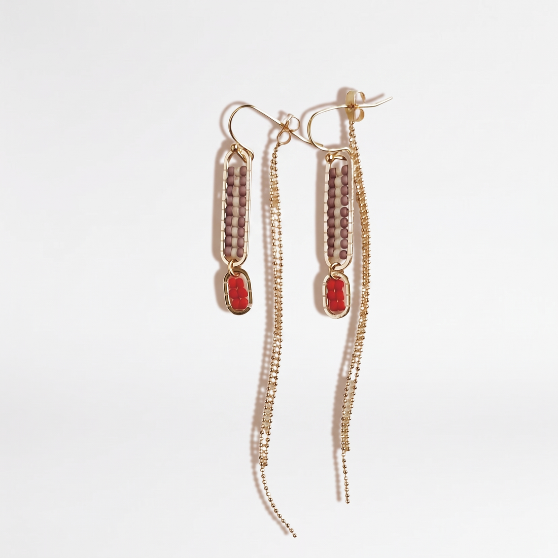 Sasha Stripe Beaded Earrings, Mauve Stripe/Poppy seed beads, red oval accents, gold-tone ear wires & fringe, hanging pair on…