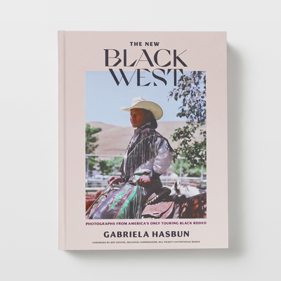 
                    
                      Chronicle Books The New Black West book, light peach cover featuring a Black rodeo rider in a cowboy hat, front view on…
                    
                  