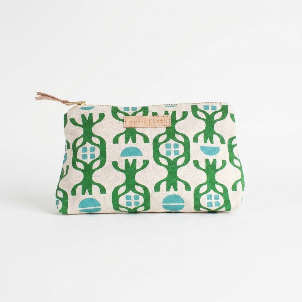 Erin Flett Chalet Pouch - (Turquoise + Kelly Green) studio product photo hanging from a wooden wall hook on a neutral…