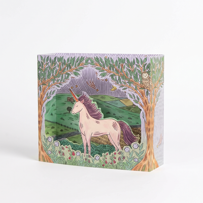 
                    
                      Twilight Unicorn die-cut greeting card, featuring a pink unicorn illustration, green landscape, purple sky, standing angled…
                    
                  