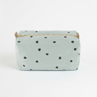 
                    
                      Rose in April Vic Toiletry Bag - Blue Hearts studio product photo hanging from a wooden wall hook on a neutral off-white…
                    
                  