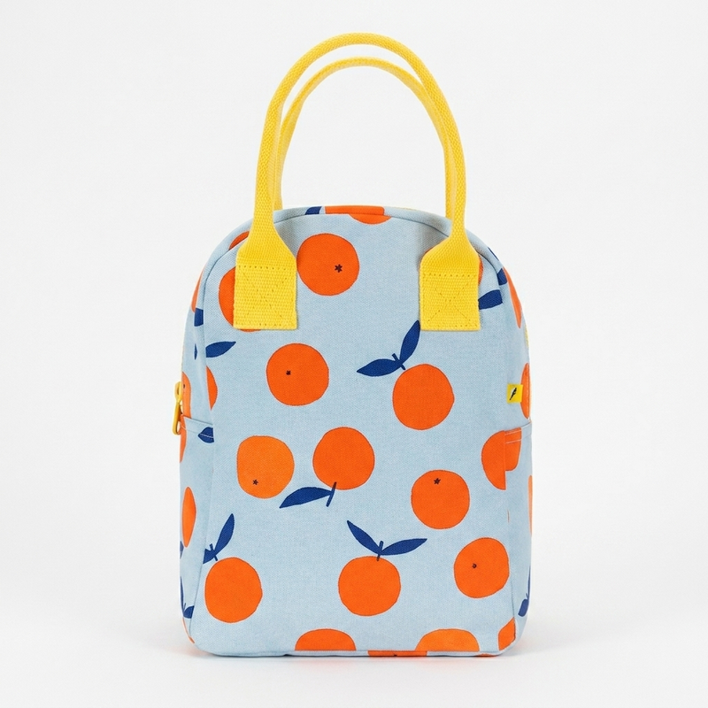 Fluf Zipper Lunch Bag - Oranges studio product photo hanging from a wooden wall hook on a neutral off-white background